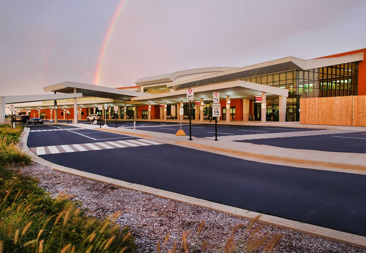 Kalamazoo/Battle Creek International Airport terminal exterior with a rainbow overhead