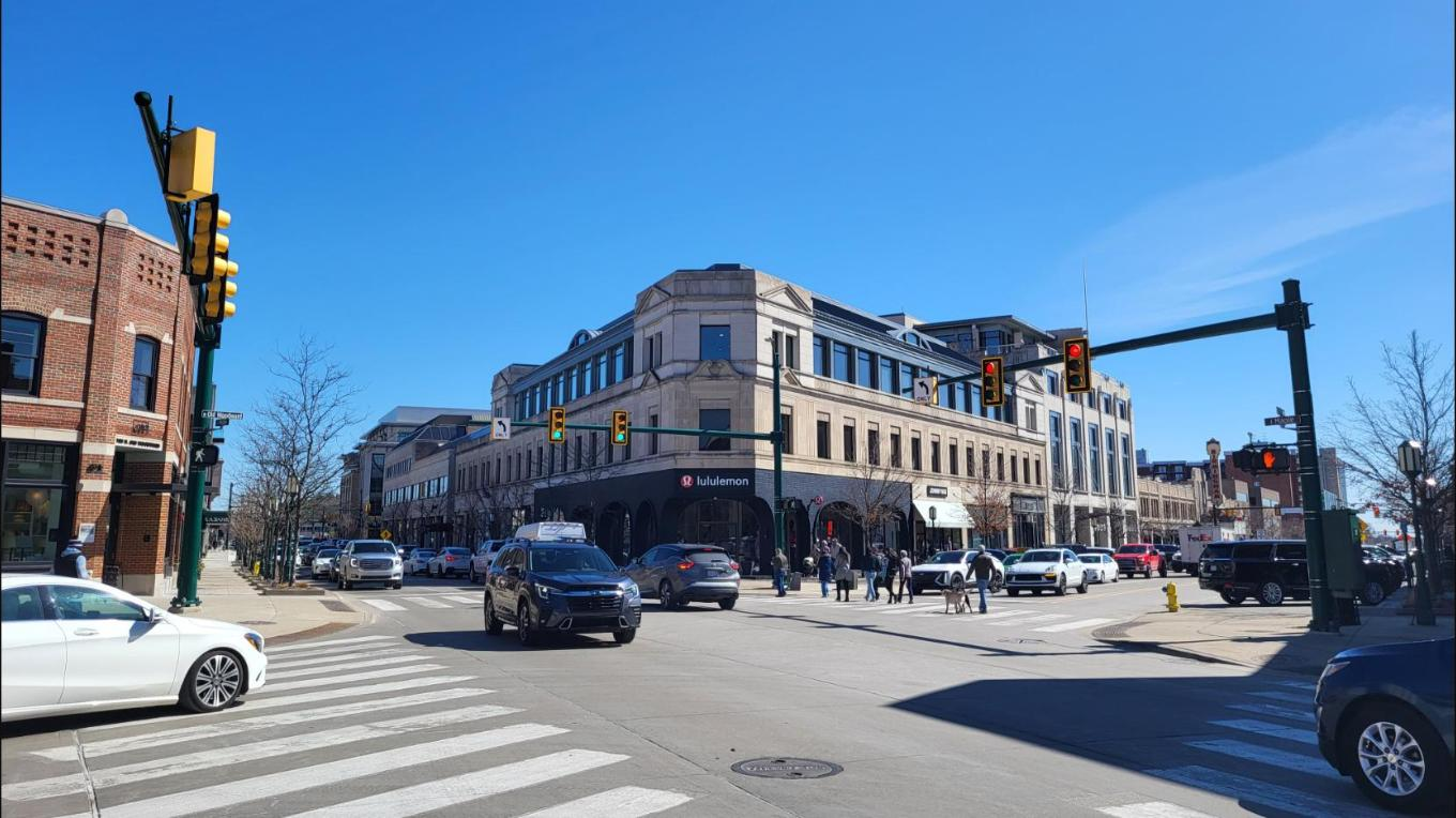 Downtown Birmingham, Michigan street intersection with shops and traffic