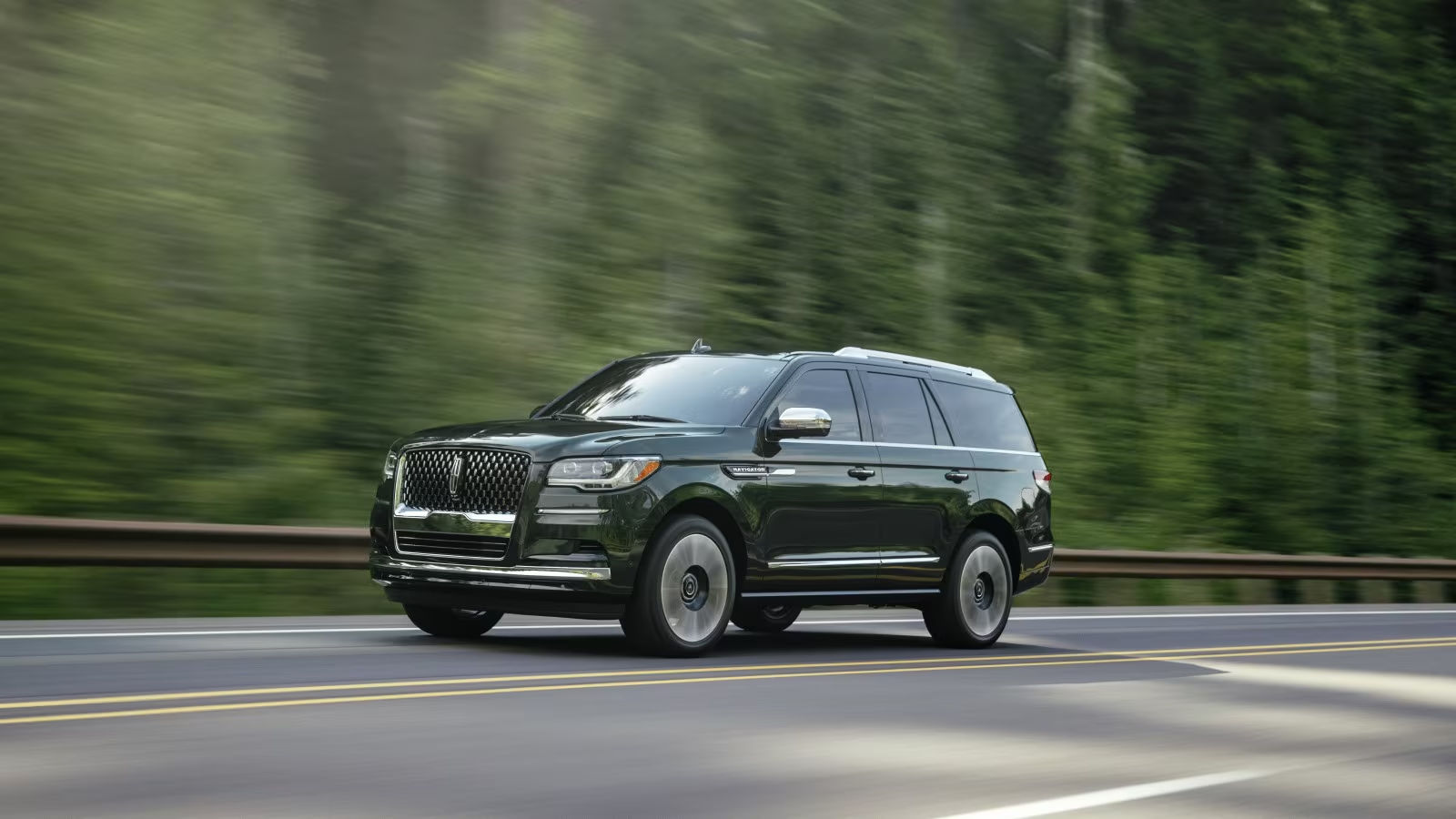 Lincoln Navigator L Black Label SUV driving on a highway