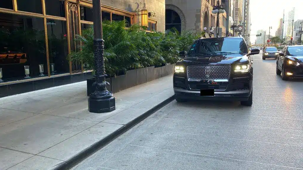 Lincoln Navigator L parked on a downtown city street